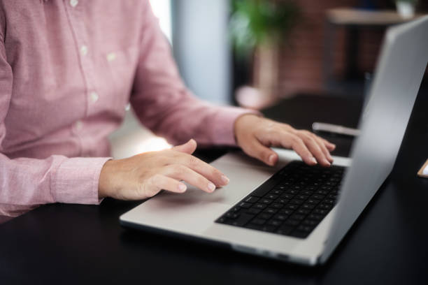 istock Businesswoman typing on laptop computer 1718706378