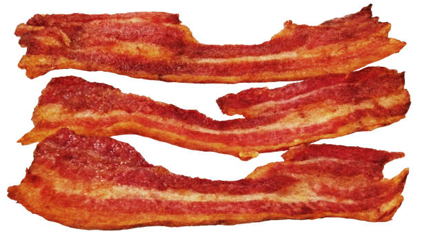 istock Freshly Fried Sizzling Crispy Crunchy Gourmet Bacon Rashers Isolated On White Background High Resolution Stock Image 1718709234