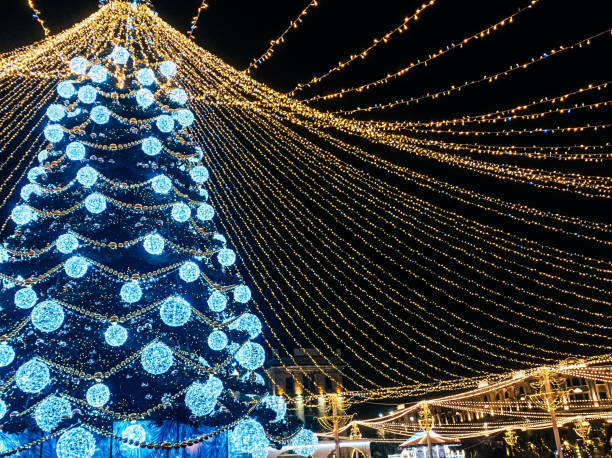 istock Christmas tree and lights at night on holiday night 1718714235