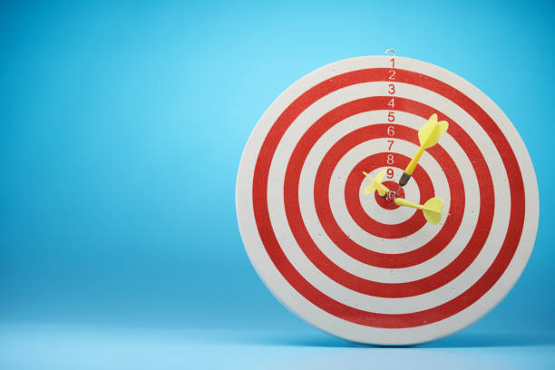 istock Red dartboard and arrows on blue background. 1718717706