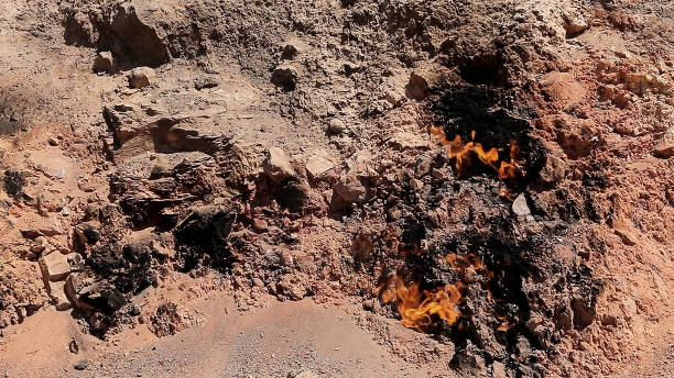 Natural Gas Fire on Mountainside, Yanar Dag in Baku Azerbaijan. Yanar Dag is a natural gas fire which blazes continuously on a hillside near Baku City. baku national park stock pictures, royalty-free photos & images