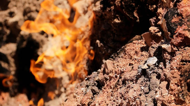 Natural Gas Fire on Mountainside, Yanar Dag in Baku Azerbaijan. Yanar Dag is a natural gas fire which blazes continuously on a hillside near Baku City. baku national park stock pictures, royalty-free photos & images