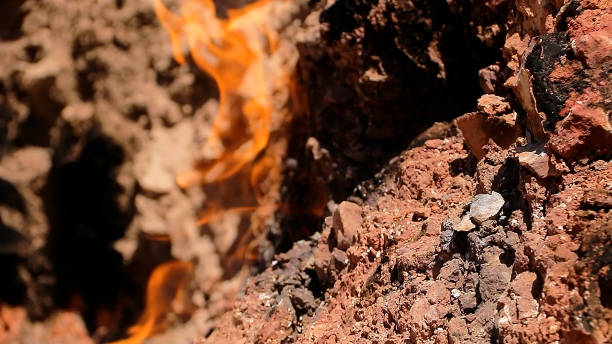 Natural Gas Fire on Mountainside, Yanar Dag in Baku Azerbaijan. Yanar Dag is a natural gas fire which blazes continuously on a hillside near Baku City. baku national park stock pictures, royalty-free photos & images