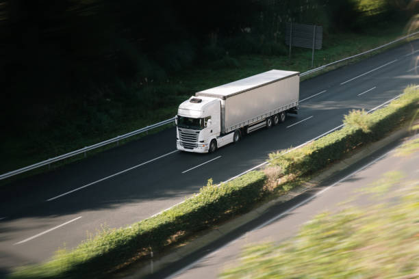 istock Semi truck in motion on a highway 1718718865