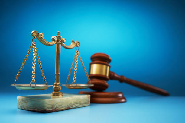 istock scale libra and gavel hammer against blue background 1718719409