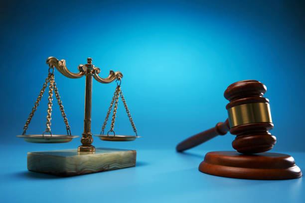 istock scale libra and gavel hammer against blue background 1718719429