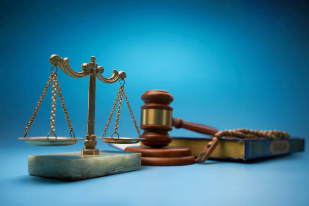 istock koran, prayer beads ,scale libra and gavel hammer  against blue background 1718719441