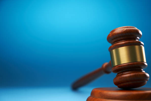istock gavel hammer against blue background with copy space 1718720029