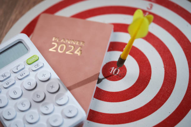 istock 2024 diary and  calculator on the wooden table 1718724611