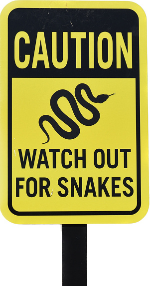 rattlesnake warning sign reminding to stay on path