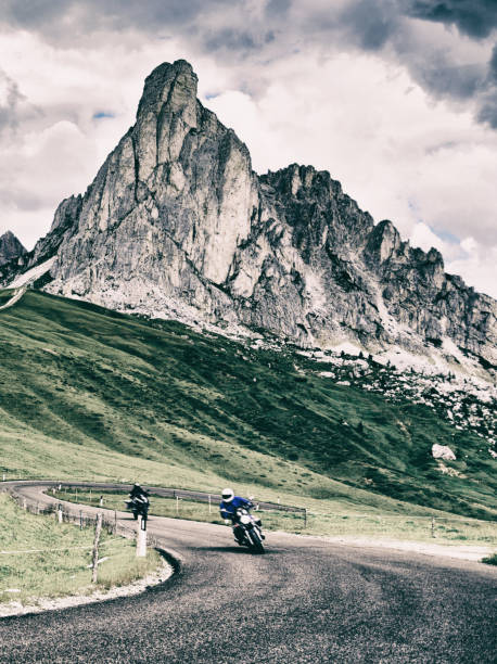 istock Bikers Riding on Winding Road. 1718754706