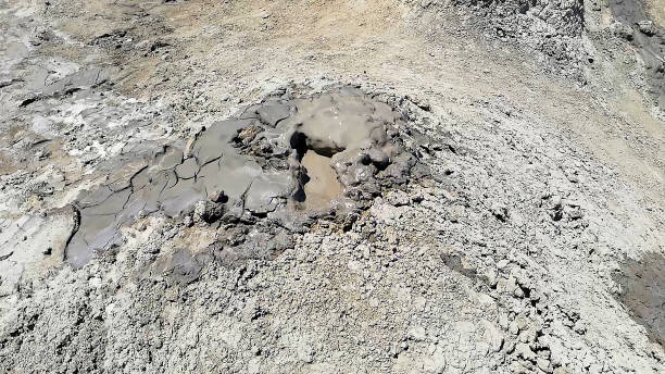 Active mud volcano in Gobustan National Park, Azerbaijan. Mud Volcanoes located in Gobustan National Park. It is a strange natural landscape in the desert, bubbling and sometimes explode. mud volcano stock pictures, royalty-free photos & images