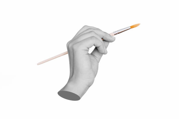 A female statue's hand holding a paintbrush isolated on a white background. Modern design