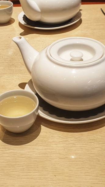 istock a tea pot and a cup of tea on a table 1718773588