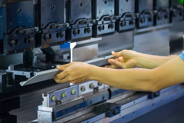 istock Close up the bending machine operator hold the sheet metal parts. 1718774213