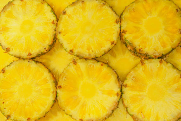 istock Pineapple juicy yellow slices as a background. 1718774760