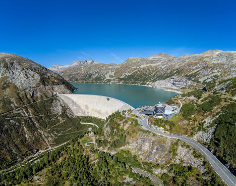 Kölnbrein Dam and the Koelnbreinspeicher reservoir in the Maltatal Carinthia Austria during an overcast springtime day in the Hohe Tauern range in the Alps.