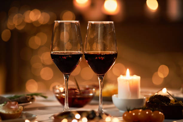 istock Close up of two wine glasses on dinner table 1718783203