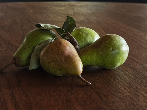 Fresh organic pears on old wood. Fruit background. Pear autumn harvest.