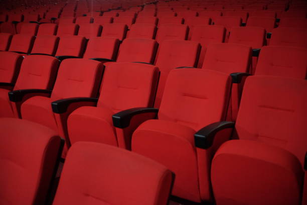 istock Rows of red chairs in an entertainment performance hall 1718797871