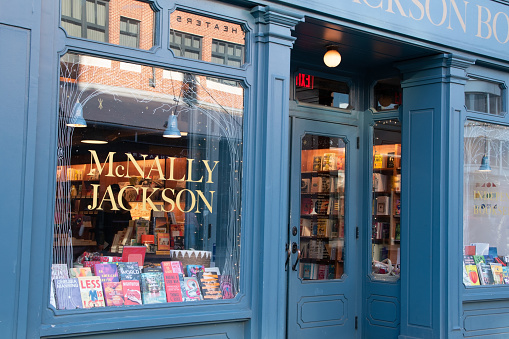 A cozy Manhattan bookstore showcase in New York City, USA, featuring a captivating display of educational books, creating a nostalgic and inviting atmosphere that encourages reading and study.