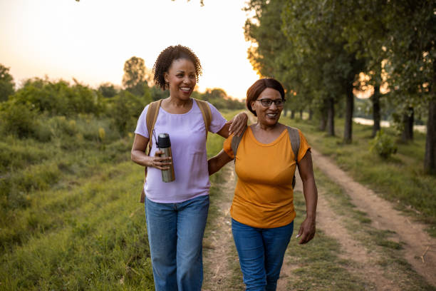 istock Mother and daughter taking a walk in nature 1718817812