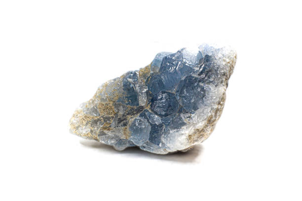 istock Real light blue celestine crystal cluster isolated on white background 1718818332