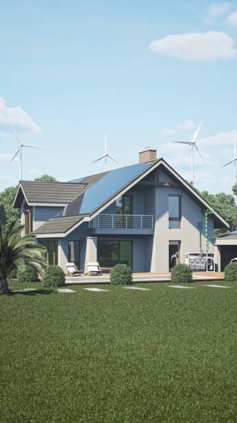 istock Eco Home With Solar Panels And Windmills To Use Alternative Energy 1718820070