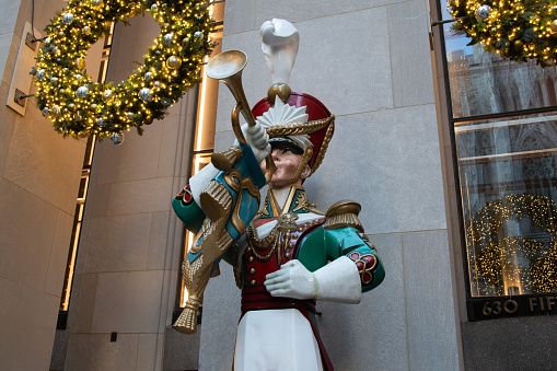 Rockefeller Center in Manhattan, NYC, boasts a striking vintage sculpture featuring a Trumpeter Hussar of the Guard. This impressive guard figure stands tall as a captivating symbol of the city's rich history and grandeur.