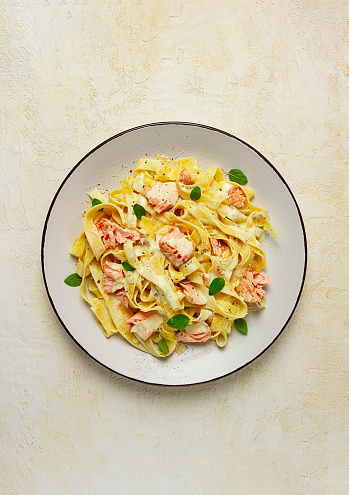 tagliatelle pasta, in cream sauce with salmon, homemade, no people,
