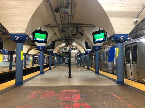 The PATH train station in Hoboken, NJ, USA is a bustling transportation hub connecting New Jersey to Manhattan, offering easy access to New York City via a historic and well-maintained railway station.