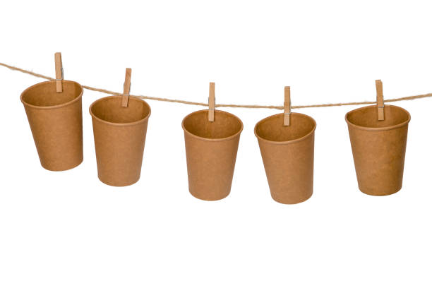 istock Paper cups with clothespins on a rope 1718861659