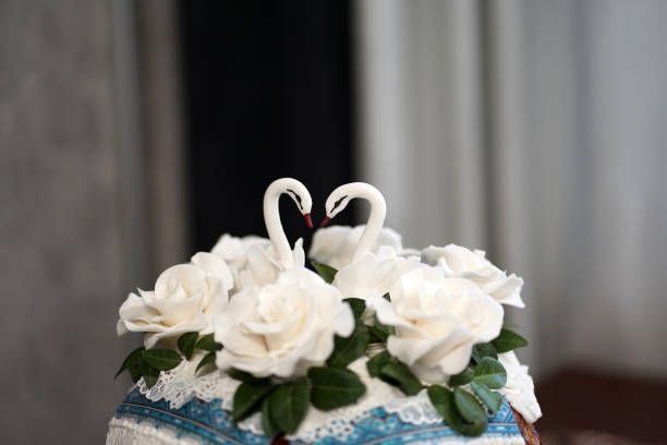 The wedding cake is decorated with two swans. Preparation for the wedding celebration.