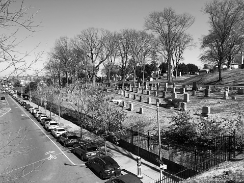 Black silhouettes of tombstones, crosses and tombstones. Elements of the cemetery. Panorama of the cemetery.