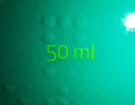 50 ml in faint green color , green background