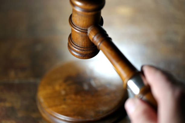 istock wooden gavel above sound block 1718890782
