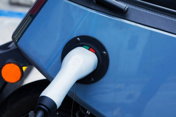 istock Charging electric motorcycle at gas station 1718892609