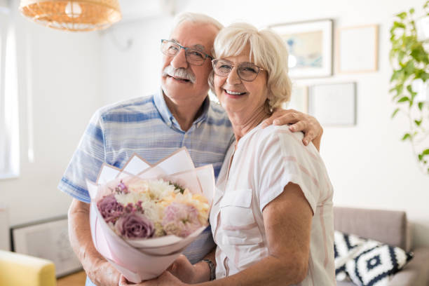 istock Senior Woman's Home Gift Unwrapping 1718897854