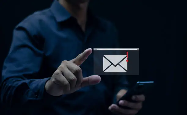 Photo of Hand pointing at mail icon, Gmail message notification concept, network security, mobile phone, smartphone