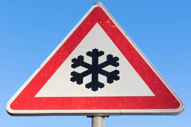 istock German road sign: road ahead freezes easily and is then slippery 1718929828