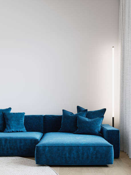 istock Minimalism interior closeup vertical image with blue sofa, white walls and floor lamp. 3d render illustration mockup. 1718934824