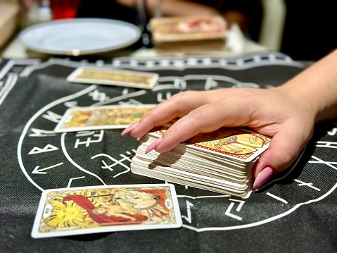 Tarot reader picking tarot cards