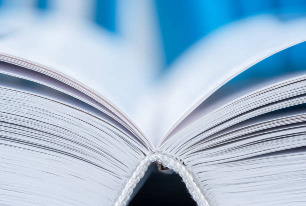 istock Edges of open book pages, macro view 1718958847