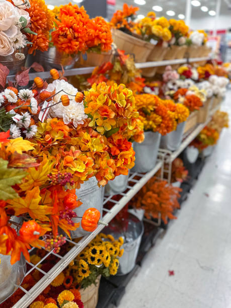 istock Plastic flowers in a window in supermarket 1718981772