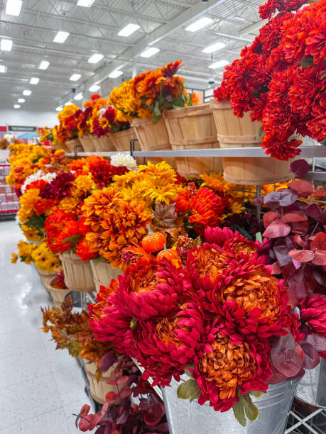 istock Plastic flowers in a window in supermarket 1718982276