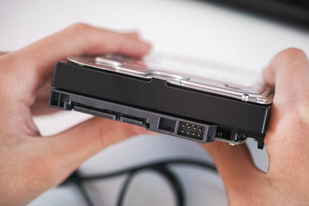 istock A man holding a brand new high capacity hard disk drive in his hands 1718983385