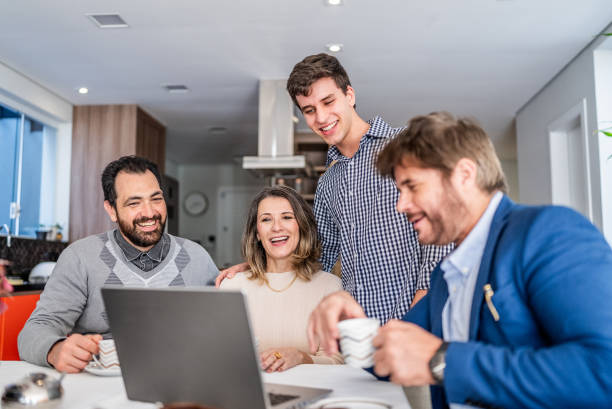 istock Finance advisor talking to family at home 1719000441
