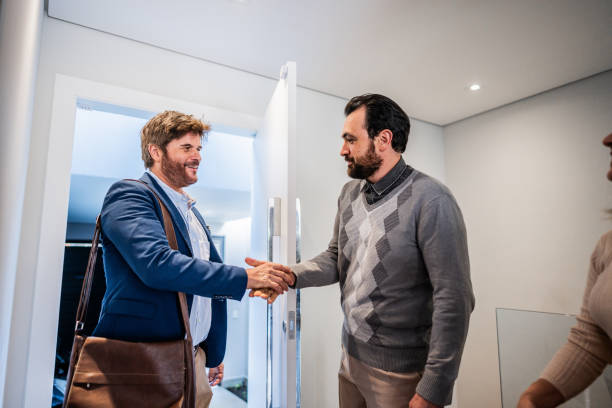 istock Finance advisor arriving at customer's house 1719001523