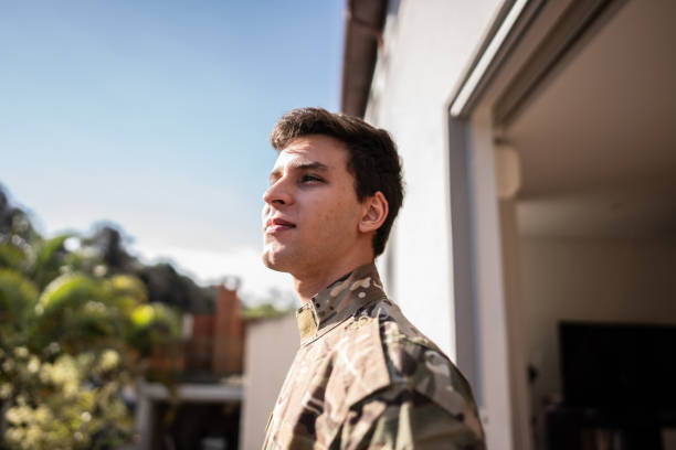 Army soldier contemplating outdoors