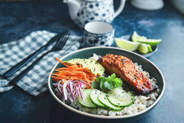 istock Spicy Salmon Bowl with Rice, Carrots, Cucumber and Avocado 1719031976